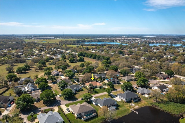 drone / aerial view with a residential view and a water view