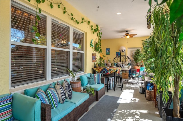 view of patio with outdoor lounge area and a ceiling fan