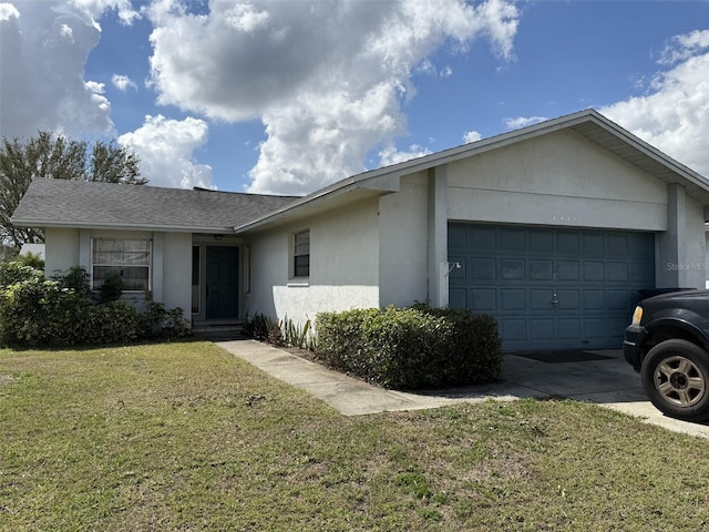 ranch-style house featuring a shingled roof, concrete driveway, stucco siding, an attached garage, and a front yard