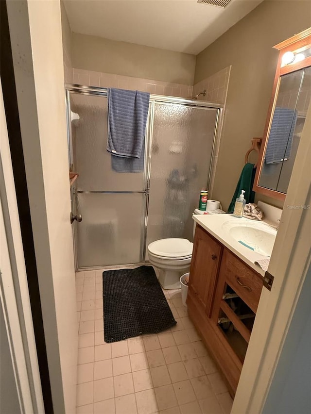 full bathroom with toilet, visible vents, vanity, tile patterned floors, and a stall shower