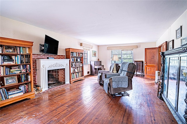 living area featuring a fireplace and hardwood / wood-style flooring