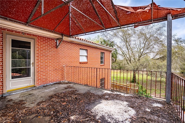view of patio / terrace featuring fence