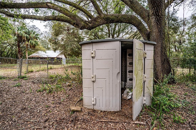 view of shed with fence