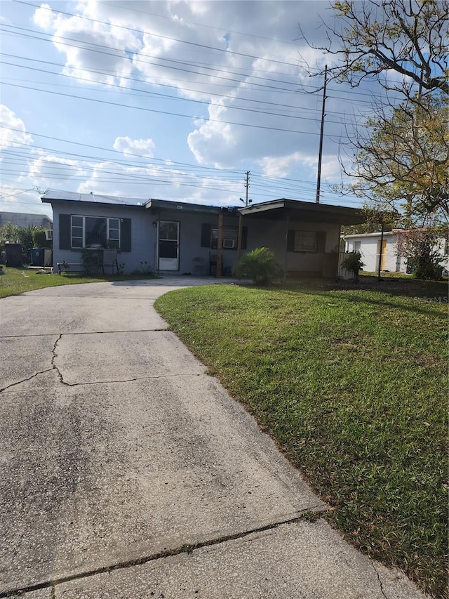 ranch-style home with a front yard