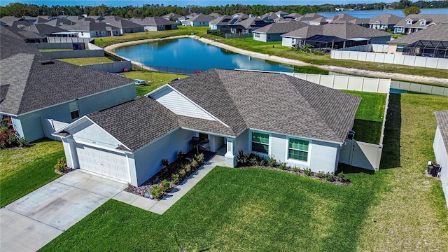 birds eye view of property featuring a water view and a residential view