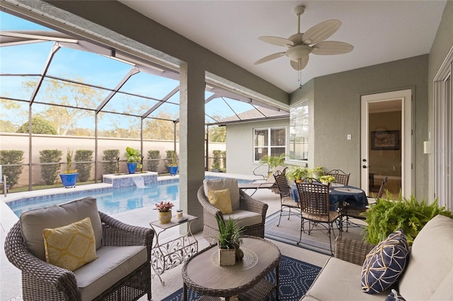 view of patio / terrace with a lanai, an outdoor hangout area, and a ceiling fan
