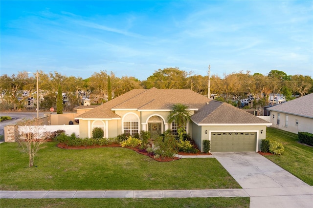 view of front of house featuring a garage, driveway, roof with shingles, stucco siding, and a front lawn
