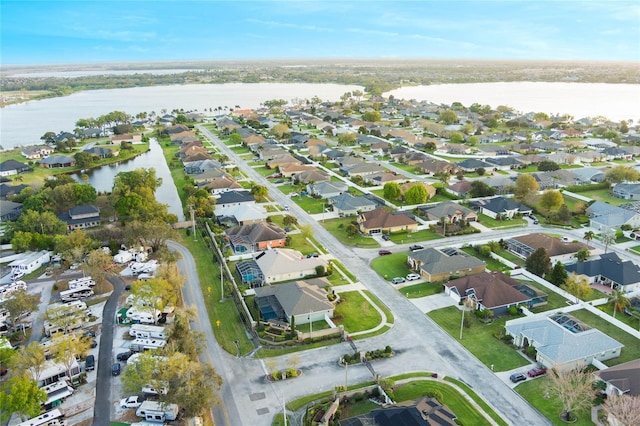 aerial view featuring a water view and a residential view