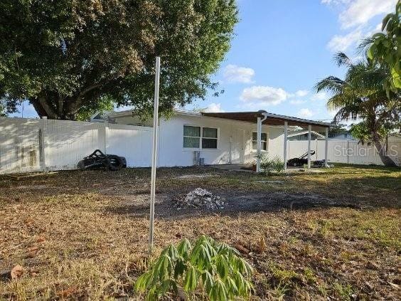 view of home's exterior with fence