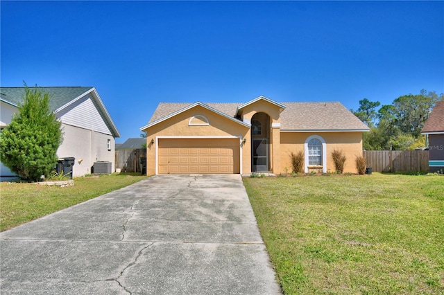 ranch-style house with cooling unit, a garage, fence, driveway, and a front yard