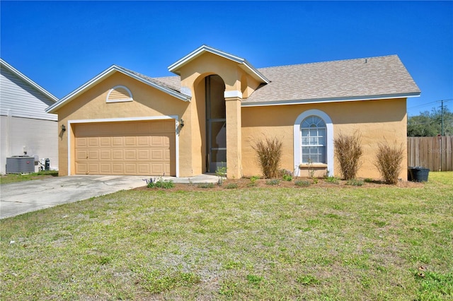 ranch-style house featuring cooling unit, a garage, concrete driveway, stucco siding, and a front lawn