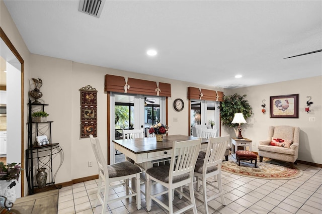 dining room featuring light tile patterned floors, recessed lighting, visible vents, and baseboards