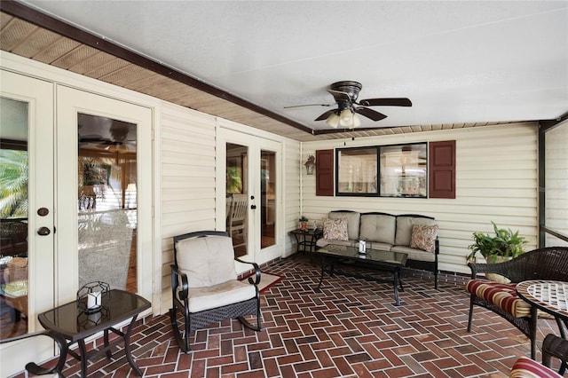 sunroom with ceiling fan and french doors