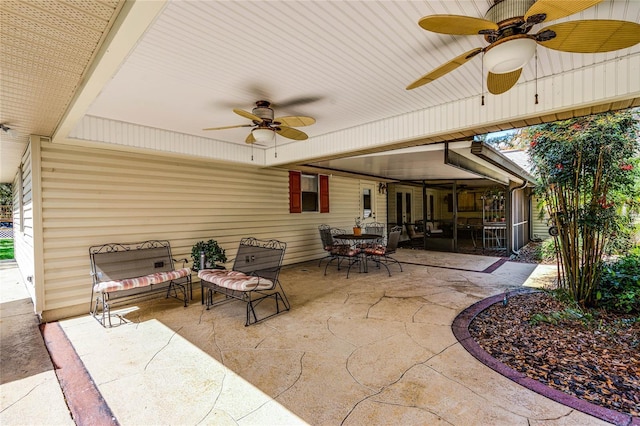 view of patio with a sunroom, outdoor dining area, ceiling fan, and an outdoor living space