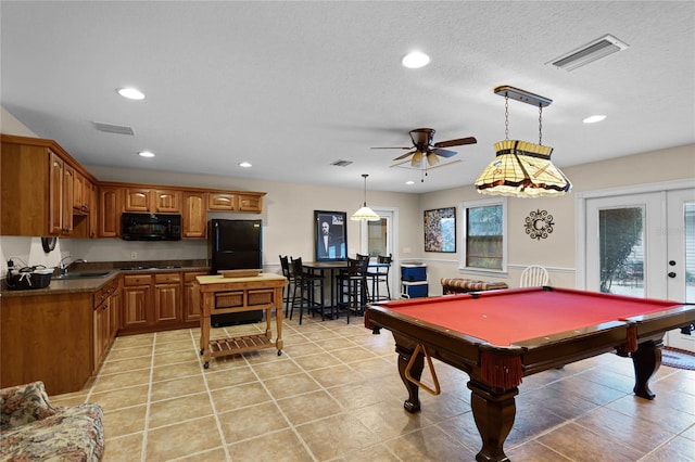 playroom featuring french doors, a sink, and visible vents