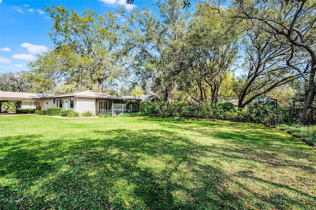 view of yard with a sunroom