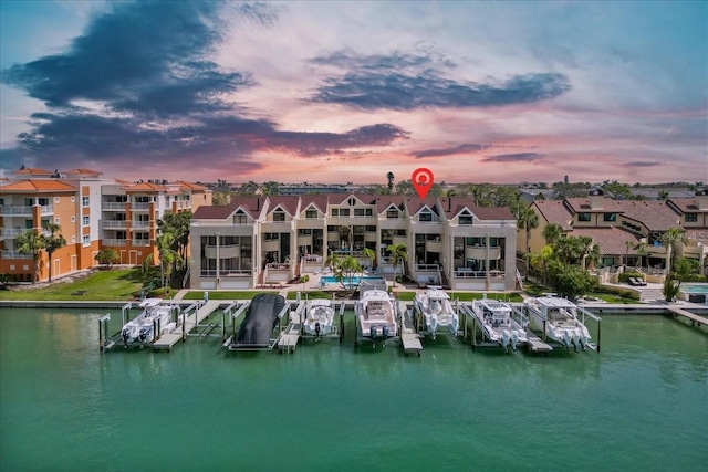 exterior space with a boat dock and a residential view