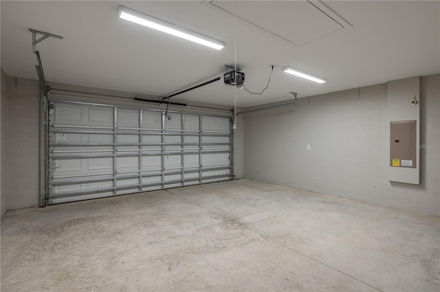 garage featuring electric panel and a garage door opener