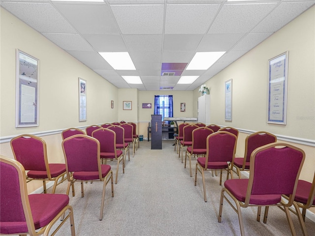 misc room featuring a drop ceiling, carpet, and visible vents