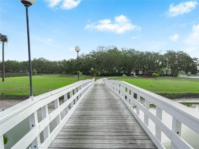 view of property's community with a lawn