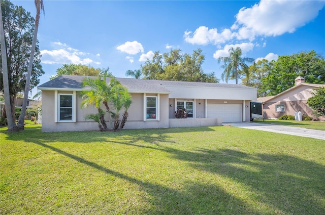 single story home featuring a garage, driveway, a front yard, and stucco siding