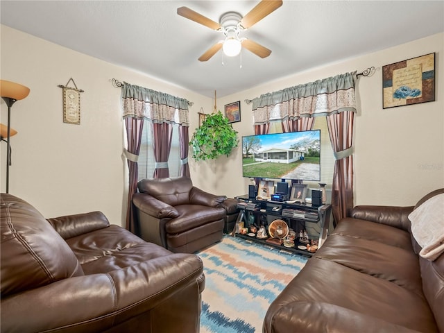 living area with ceiling fan