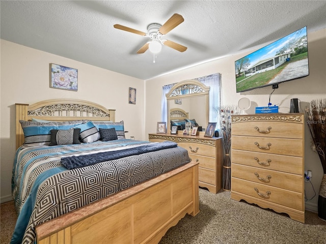 carpeted bedroom with a ceiling fan and a textured ceiling