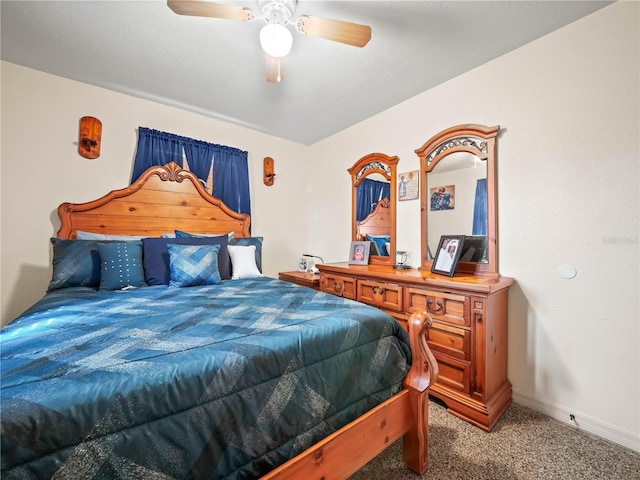 bedroom with carpet, a ceiling fan, and baseboards