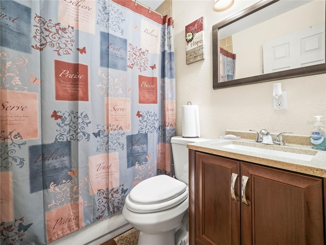 full bathroom featuring toilet and vanity