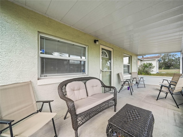 view of patio featuring a porch