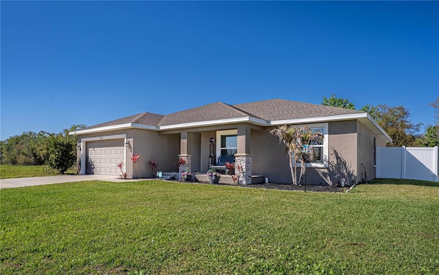 view of front of house with a garage, driveway, fence, and stucco siding