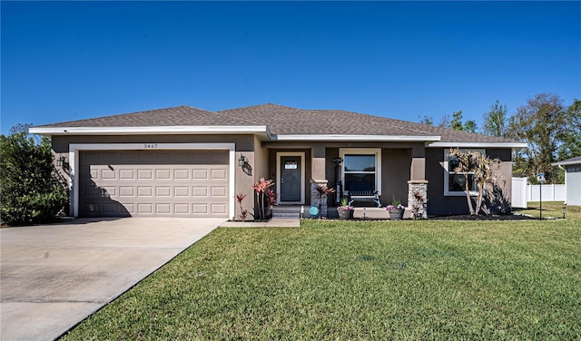 view of front of home featuring driveway, a front lawn, and stucco siding