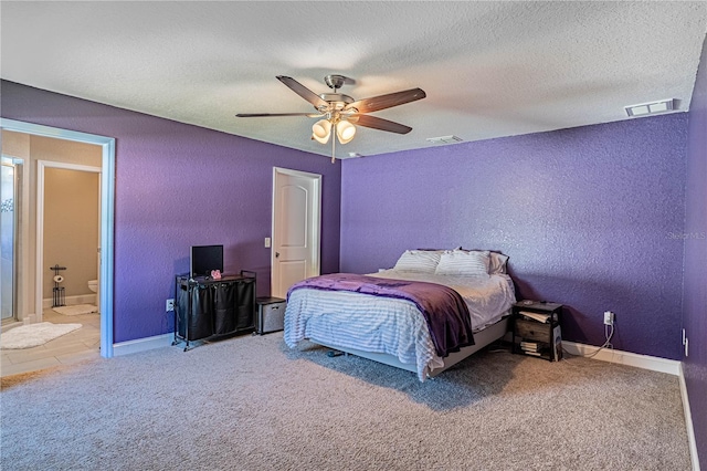 bedroom with visible vents, a textured wall, a textured ceiling, and carpet flooring