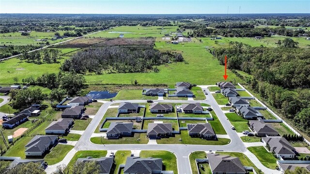 bird's eye view with a residential view and a water view