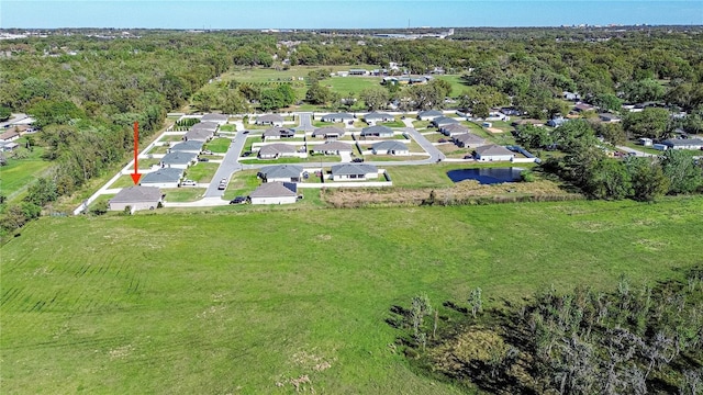 bird's eye view featuring a residential view and a view of trees