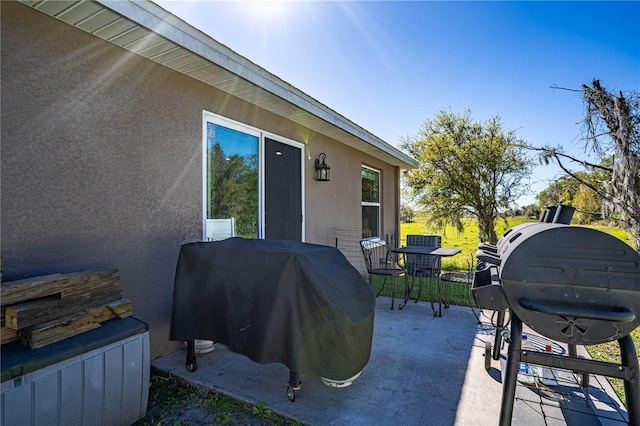 view of patio / terrace featuring outdoor dining area and grilling area