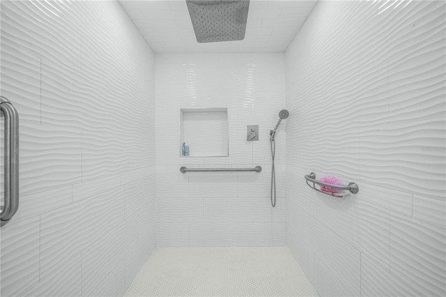 full bathroom with a tile shower