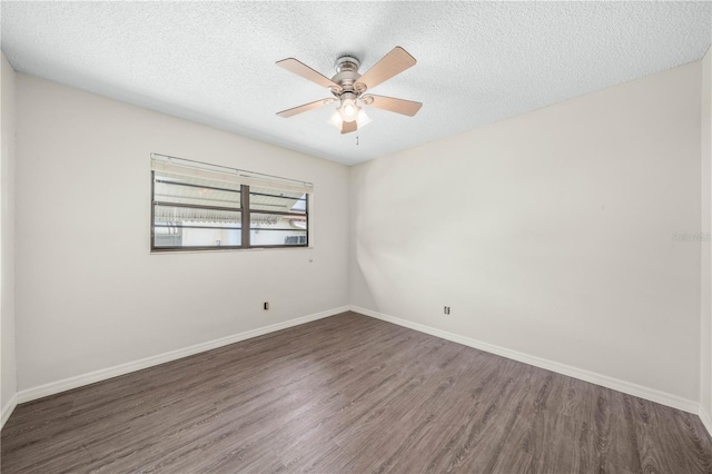 unfurnished room featuring ceiling fan, a textured ceiling, baseboards, and wood finished floors