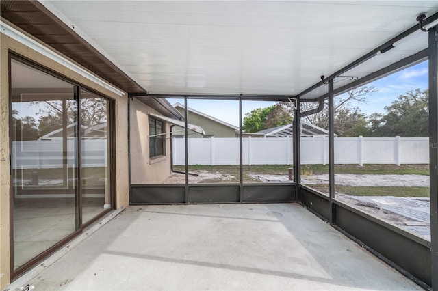 unfurnished sunroom with plenty of natural light