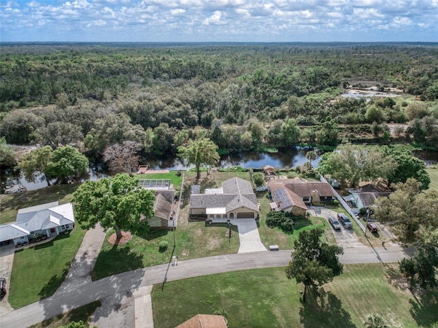 aerial view with a water view, a residential view, and a wooded view