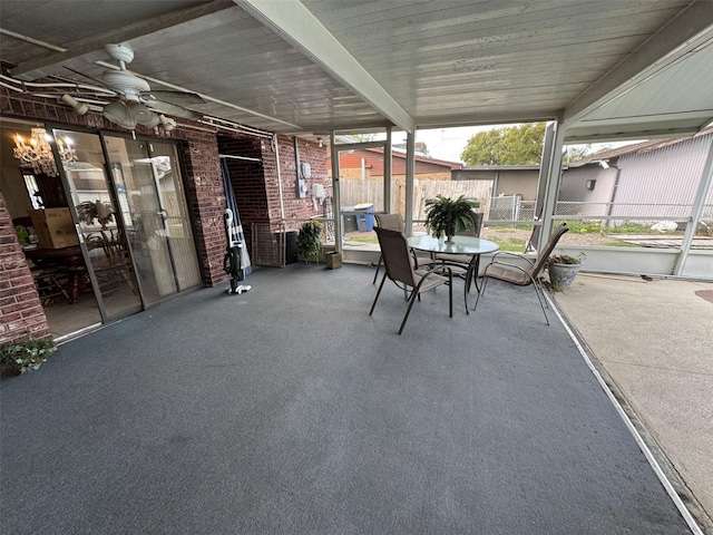 view of patio with outdoor dining area and fence