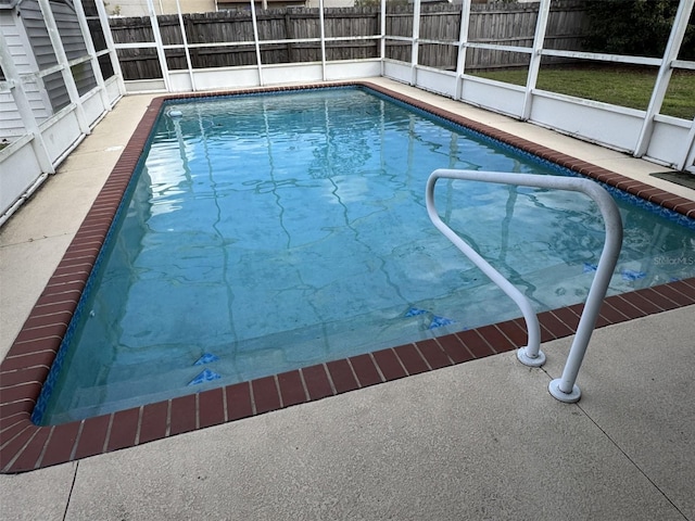 view of pool featuring a lanai, fence, and a fenced in pool