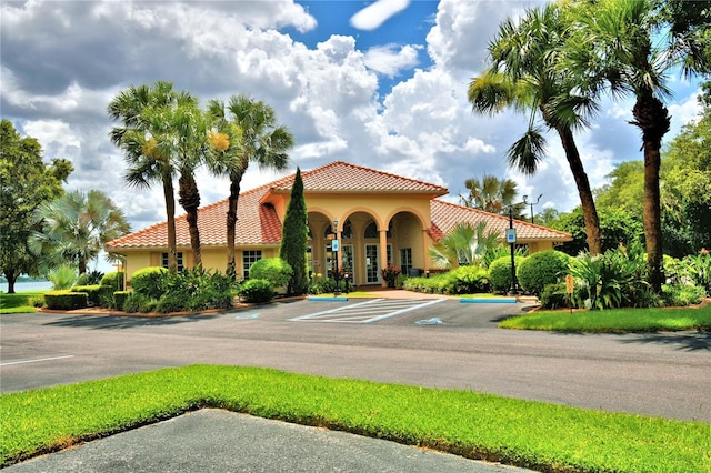 view of property featuring uncovered parking