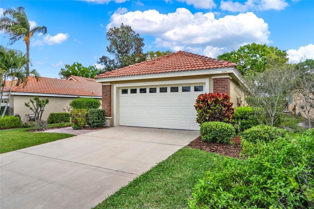 mediterranean / spanish-style home with brick siding, a tiled roof, and stucco siding