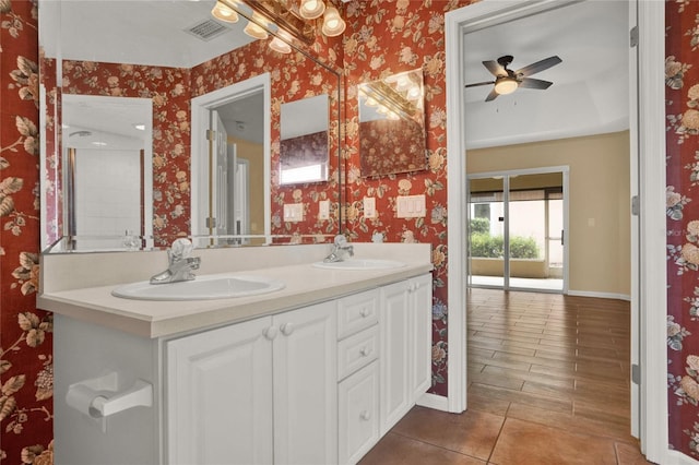 full bathroom featuring a sink, visible vents, and wallpapered walls