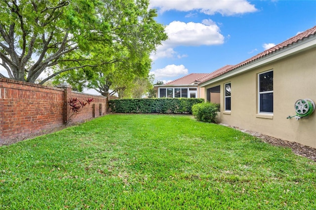 view of yard with a fenced backyard