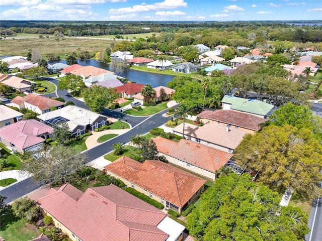 birds eye view of property featuring a residential view and a water view