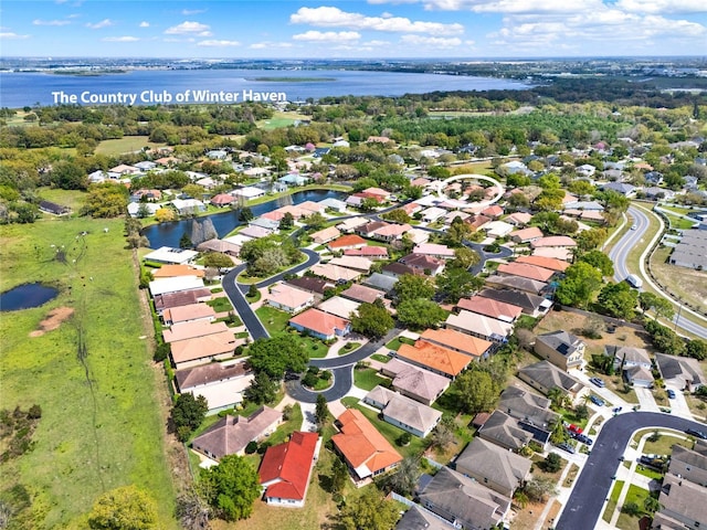 aerial view with a water view and a residential view