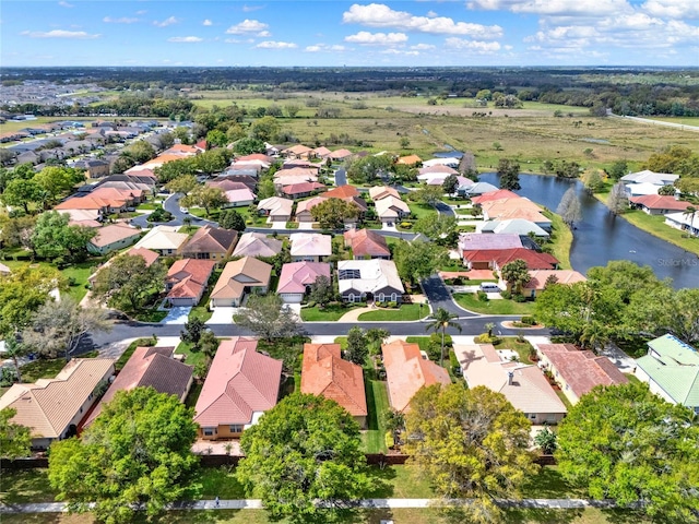 bird's eye view featuring a residential view and a water view