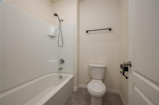 bathroom with toilet, shower / bath combination, tile patterned flooring, and baseboards